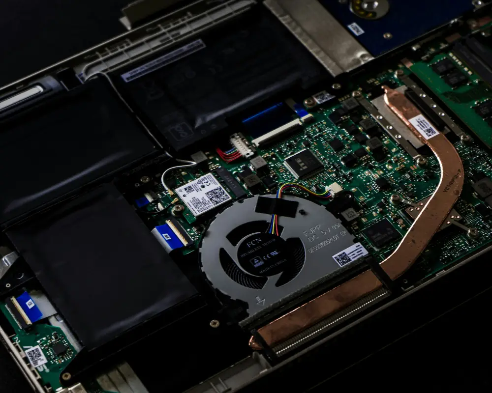 Open laptop showing internal components during computer repair
