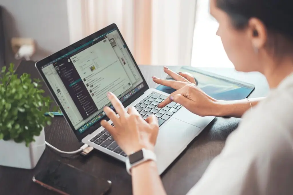Woman using a laptop for remote work and communication