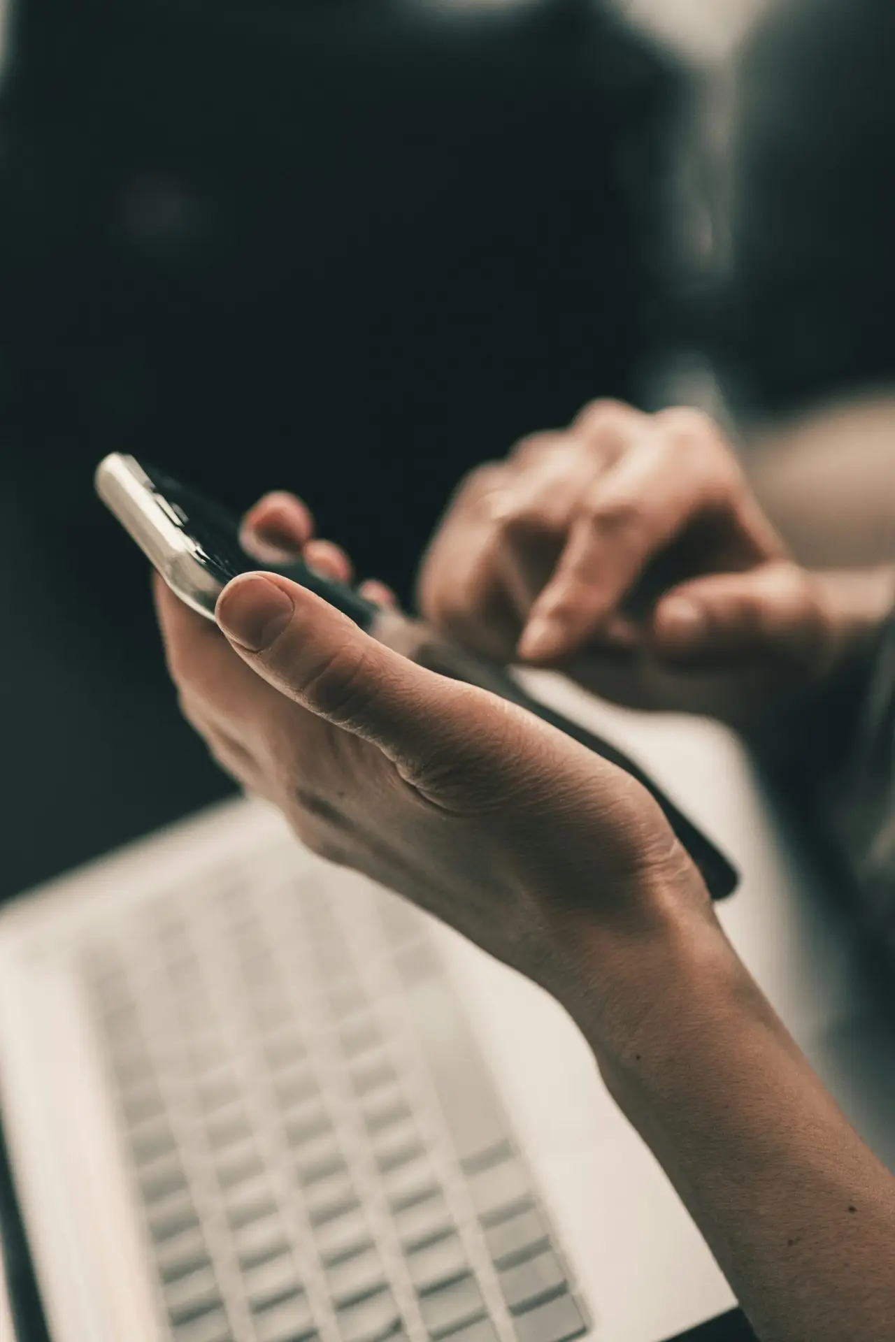 Person using a smartphone for everyday technology tasks