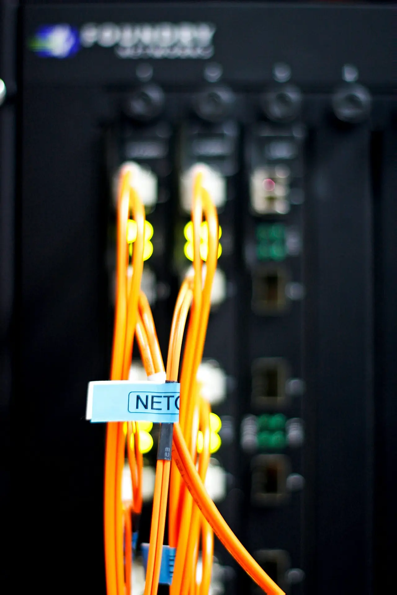 Fiber optic network cables connected to networking equipment