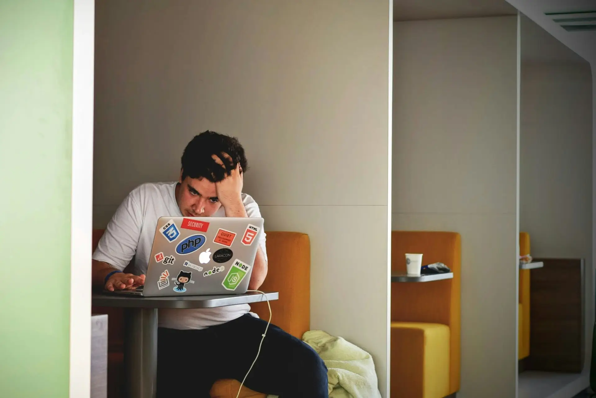 Frustrated man having trouble with a laptop computer